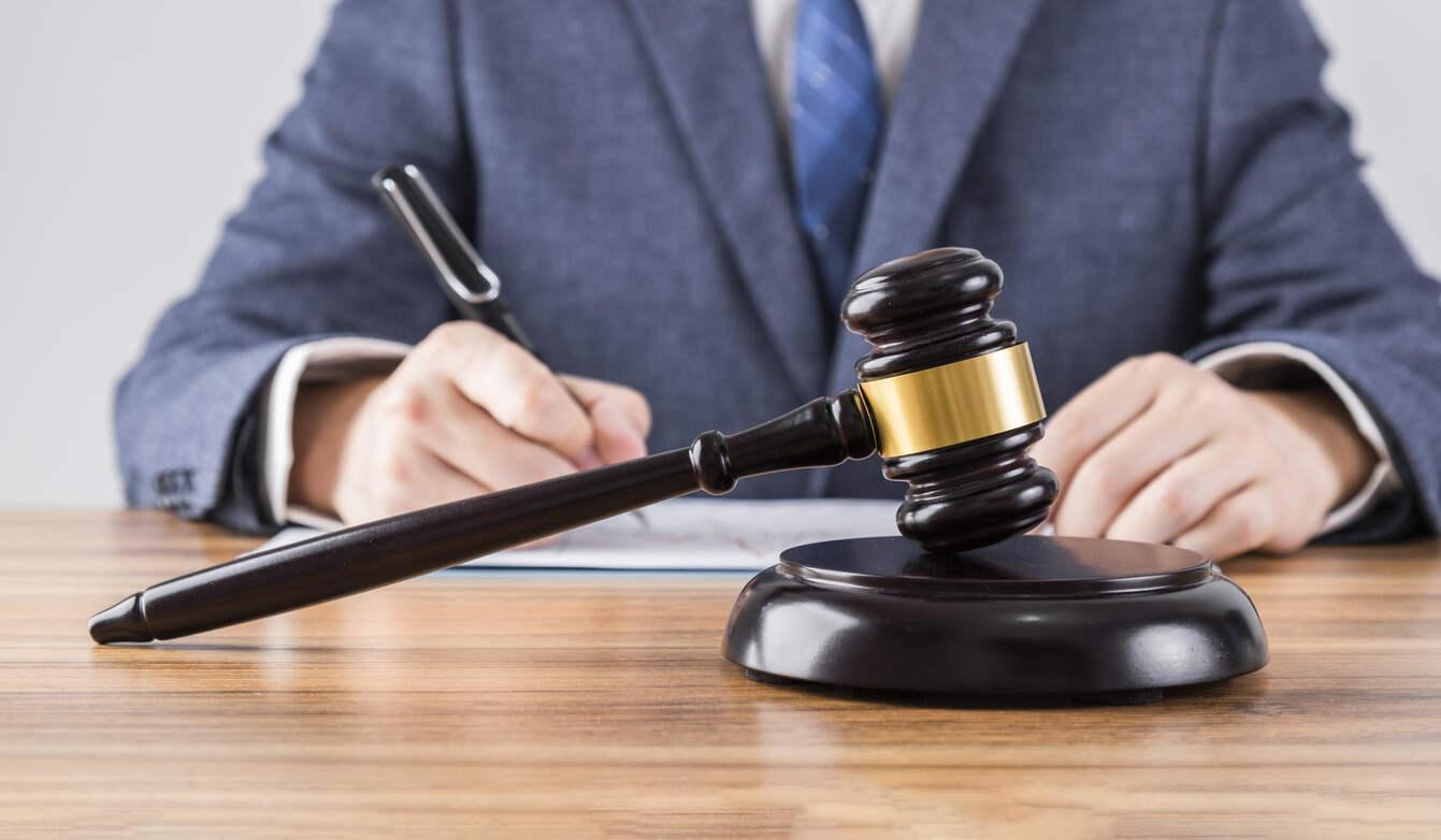 Atlanta Lawyer working and gavel placed on the table