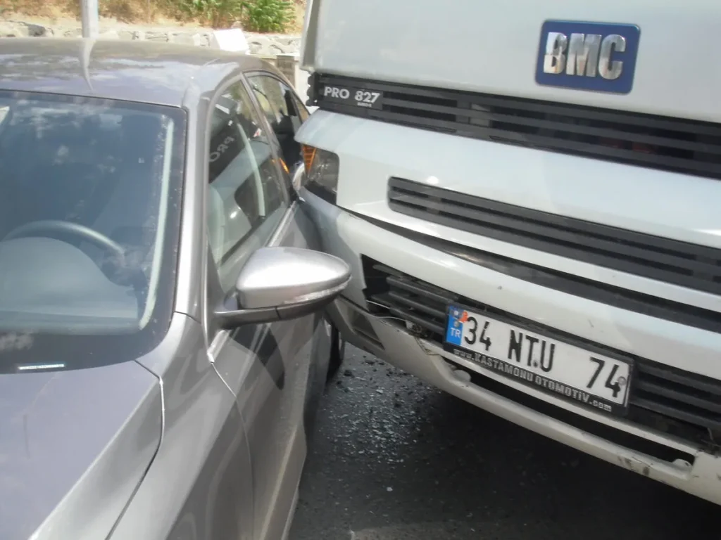 Car and tractor-trailer involved in a blind-spot collision