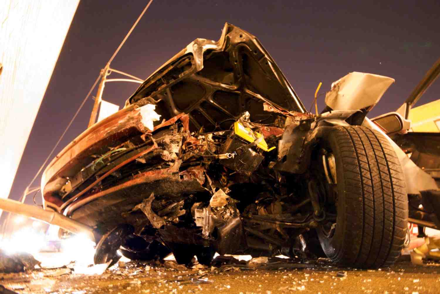 Severely damaged car after a crash, symbolizing the challenges of proving future medical damages in catastrophic car crash injuries.